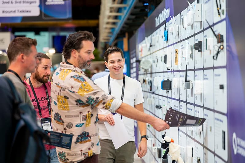 Visitors exploring devices at a previous conference